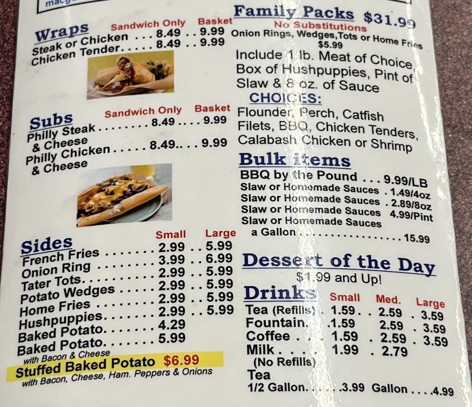 Printed menu beside breakfast dishes and hot plates.